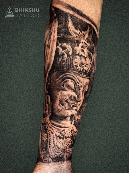 Black and grey sculpture sleeve tattoo